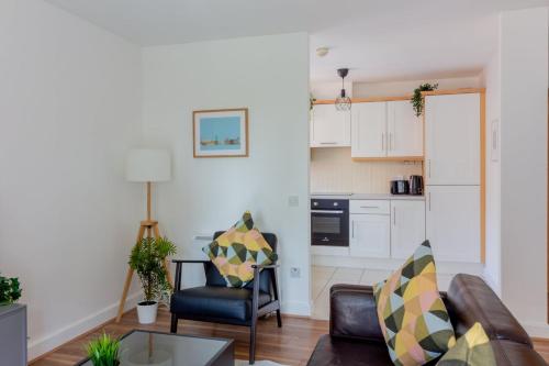 a living room with a couch and a table at GuestReady - Modern stay by Pheonix Park in Dublin