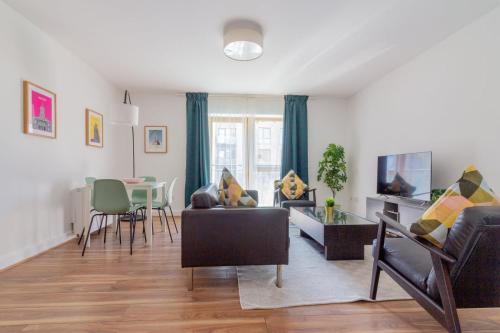 a living room with a couch and a table at GuestReady - Modern stay by Pheonix Park in Dublin