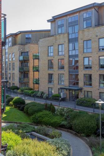 a large brick building with a walkway in front of it at GuestReady - Modern stay by Pheonix Park in Dublin