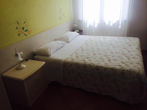 Ένα ή περισσότερα κρεβάτια σε δωμάτιο στο Archi Di Sole