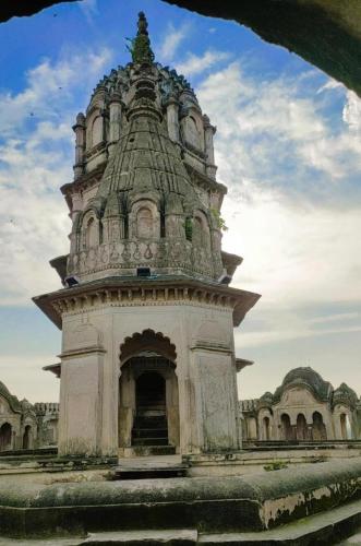 a building with a tower on top of it at Orchha Best Homestay in Orchha