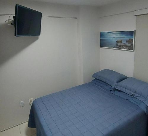 Un pat sau paturi într-o cameră la Apto Conforto Splendid Rosarinho 1Qto