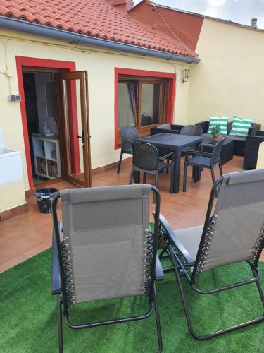 a group of chairs and tables on a patio at Terraza Mirador in A Coruña