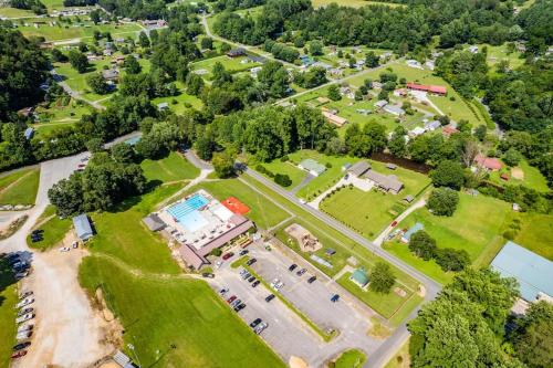 an overhead view of a park with a building and trees at STEPS TO BRYSON - MTN VIEWS, HOT TUB, FIREPIT, WALK TO TOWN! in Bryson City