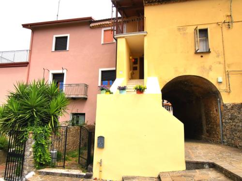 a building with an archway in front of it at Nennella Cilento House in Cuccaro Vetere