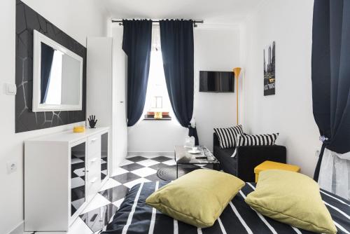 a living room with a black and white checkered floor at Apartments Paris in Umag