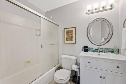 a white bathroom with a toilet and a sink at Southwestern Style Home Near Old Town Scottsdale in Scottsdale