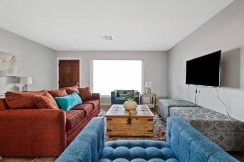 a living room with two couches and a tv at Southwestern Style Home Near Old Town Scottsdale in Scottsdale