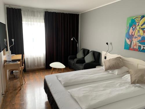 Postel nebo postele na pokoji v ubytování Bodø Hotel