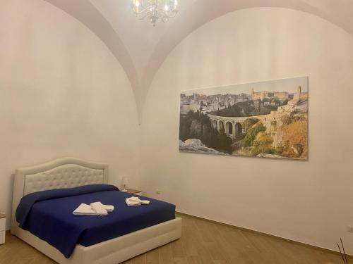 Кровать или кровати в номере Via Alchimia 11