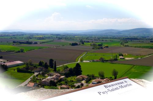 an aerial view of a house in a field at Logis du Champ De Mars in Puy-Saint-Martin