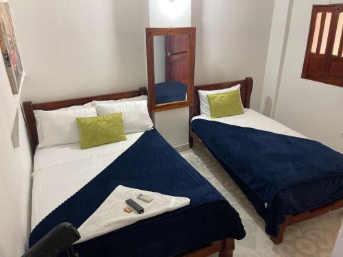 Ein Bett oder Betten in einem Zimmer der Unterkunft Hotel Majestic Mompox