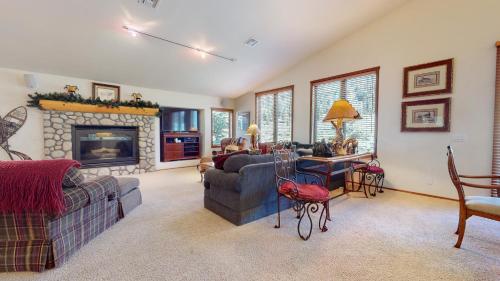 a living room with a couch and a fireplace at Snowcreek V #757 condo in Mammoth Lakes