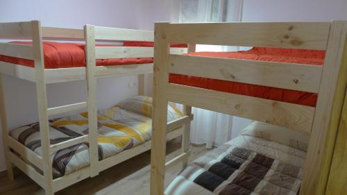 a couple of bunk beds in a room at Casa del Autón - Couto Mixto in Rubiás