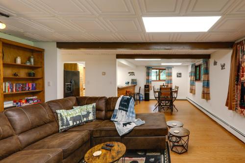 a living room with a couch and a table at Ideally Located Fairbanks Vacation Rental! in Fairbanks