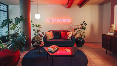a living room with a couch and a table at Casa San Fernando by Barrio México in Guadalajara