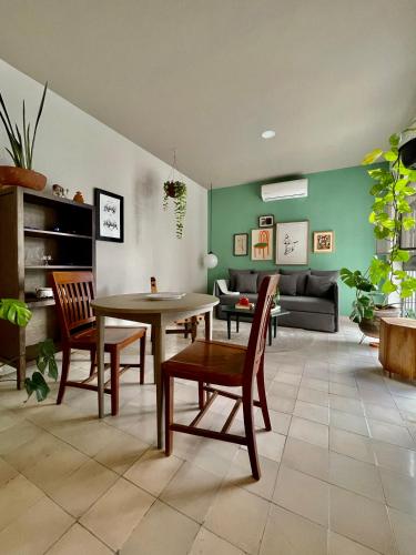 a living room with a table and chairs and a couch at Casa San Fernando by Barrio México in Guadalajara