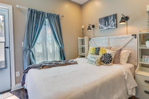 a bedroom with a large bed with a window at Cozy Philadelphia Rental Steps to Subway Station! in Philadelphia