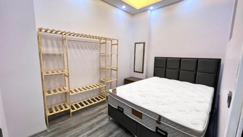 a bedroom with a bed and shelves in it at EGZ INSAAT REAL ESTATE in Istanbul