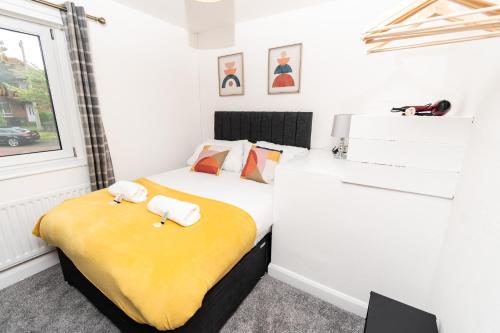 a bedroom with two beds and a window at Greenbourne - 4 bedrooms Sleeps 8 free parking in Gateshead