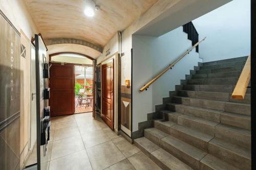 a hallway with stairs in a house at Rynek 10 Apartments in Lublin