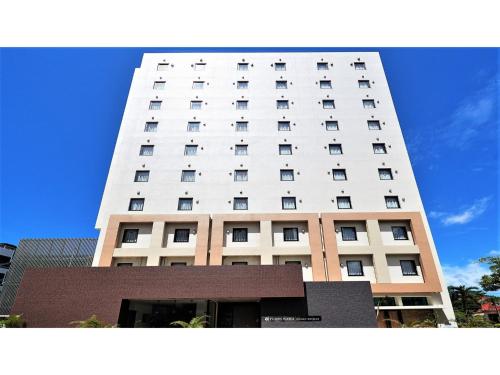 a tall white building with windows on top of it at Y's Inn Naha Oroku Ekimae - Vacation STAY 25852v in Naha