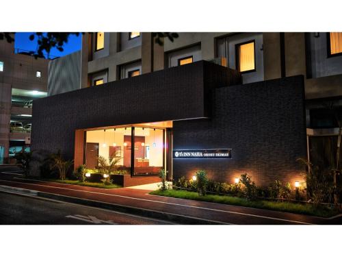 a building with a sign on the front of it at Y's Inn Naha Oroku Ekimae - Vacation STAY 25852v in Naha