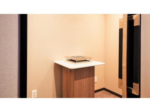 a room with a table with a book on it at Y's Inn Naha Oroku Ekimae - Vacation STAY 25852v in Naha