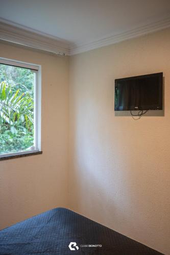 TV a/nebo společenská místnost v ubytování Flat com Piscina Térmica no Bombinhas Summer Beach