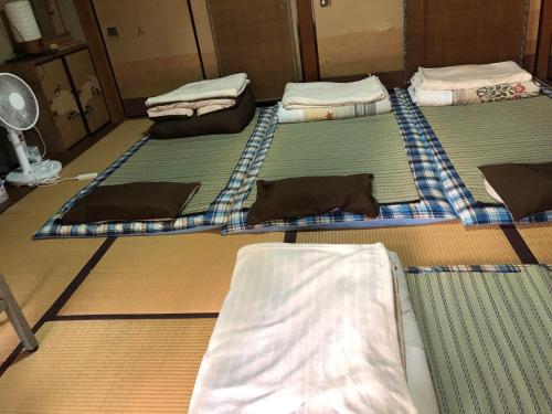 a group of four mattresses sitting on the floor at Minpaku Togenkyo 2 - Vacation STAY 15096 in Toba