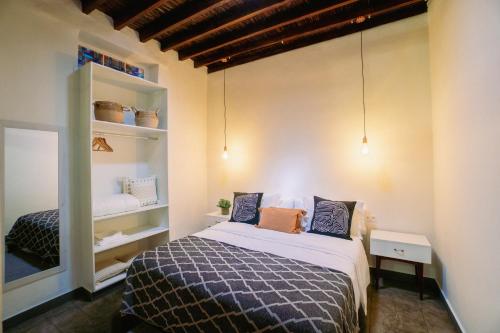 a bedroom with a bed in a room at CASA EMBLEMÁTICA MARUCA y LELI in Los Silos