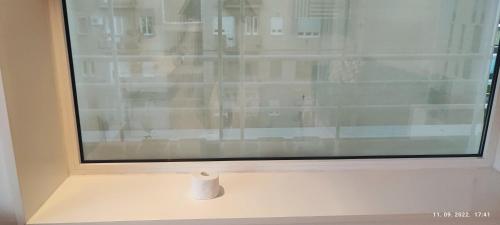 a window with a white frame on a white table at Artissimo RoofTerace in Zagreb