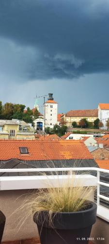 a view of a city from a balcony with plants at Artissimo RoofTerace in Zagreb