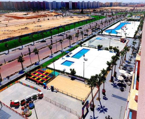 an overhead view of a swimming park in a city at Chalet In Golf Porto Marina Sia Lagoon in El Alamein