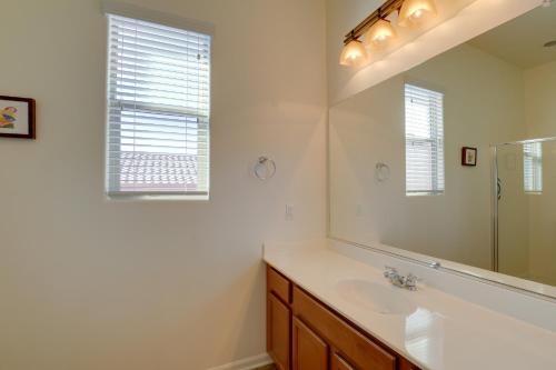 a bathroom with a sink and a mirror at Tucson Home with Private Pool and Mountain Views! in Catalina