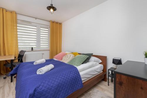 Кровать или кровати в номере Apartment Przytulna Kiełpinek by Renters