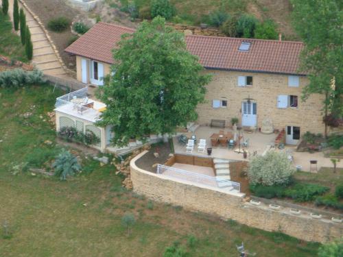 an aerial view of a house with a tree at Maison d'Hotes du Vert Vallon in Theizé