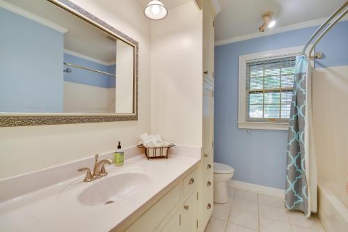 a bathroom with a sink and a toilet and a mirror at Spacious Amarillo Home with Shared Fire Pit! in Amarillo