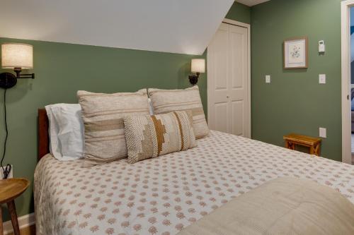 a bedroom with a large bed with green walls at Dog-Friendly Mills River Retreat Near Hiking! in Mills River