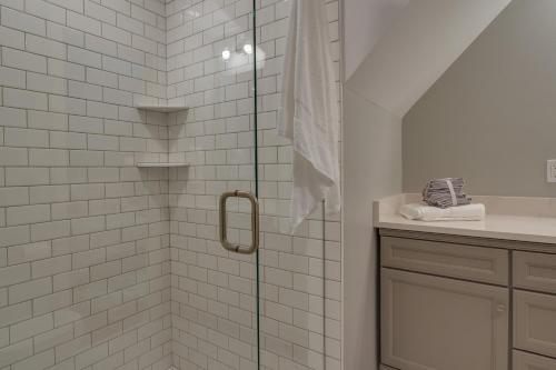 a bathroom with a shower with a glass door at Dog-Friendly Mills River Retreat Near Hiking! in Mills River