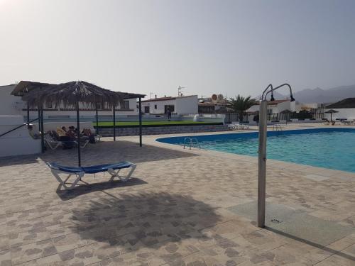 Bazén v ubytování Apartamento junto a la piscina nebo v jeho okolí