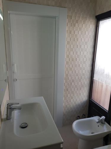 Koupelna v ubytování Apartamento junto a la piscina
