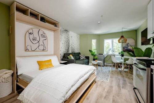 a bedroom with a bed and a living room at Hidden Gem: Historical Gastown in Vancouver