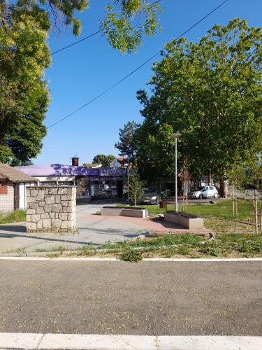 an empty parking lot with trees and a street at Bajka in Valjevo