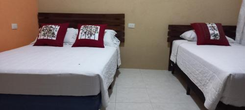 Katil atau katil-katil dalam bilik di Casa Josefa Hotel
