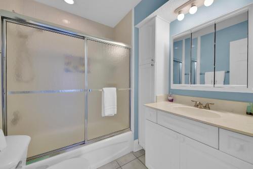 a bathroom with a shower and a sink at Heated Pool Pet Friendly Home in Jacksonville Beach