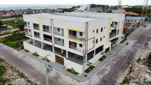 an aerial view of a building on a street at Salt Beach Atalaia Residence Inn in Salinópolis