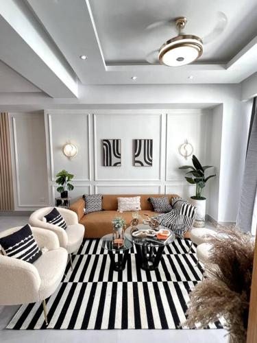 a living room with a couch and a table at Downtown Santo Domingo Luxury Apartment in Santo Domingo