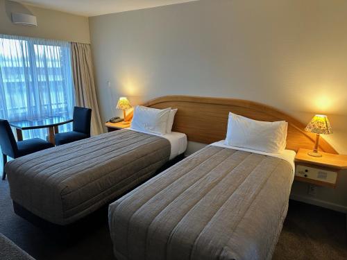 Postel nebo postele na pokoji v ubytování Distinction Heritage Gateway Hotel