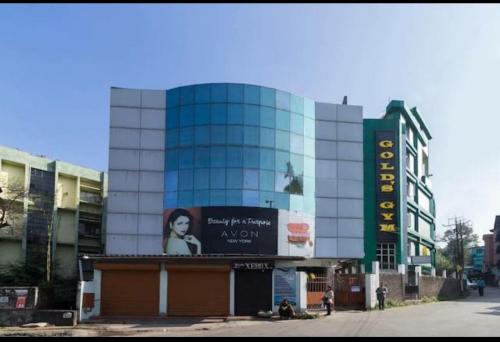 a building with a sign on the side of it at White Rabbit Guest House in Shillong